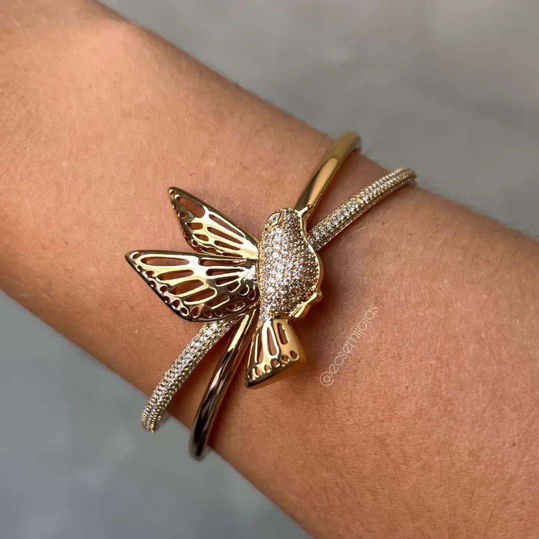 Bracelete com pássaro cravejado e asas lisas vazadas - banhado a ouro 18k