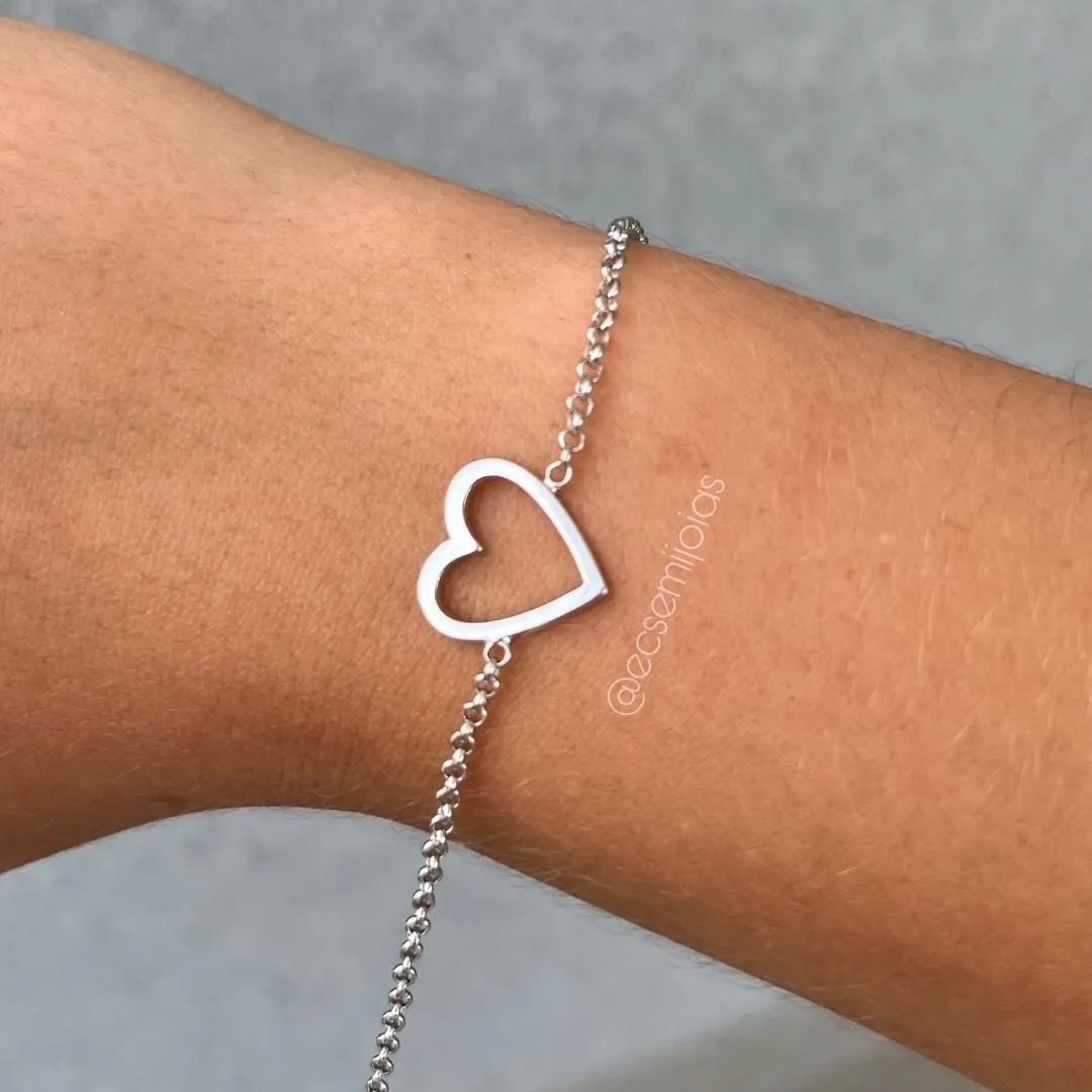 Pulseira de elo português 1,5mm com coração vazado liso no centro - 16cm + extensor - banhado a ródio branco